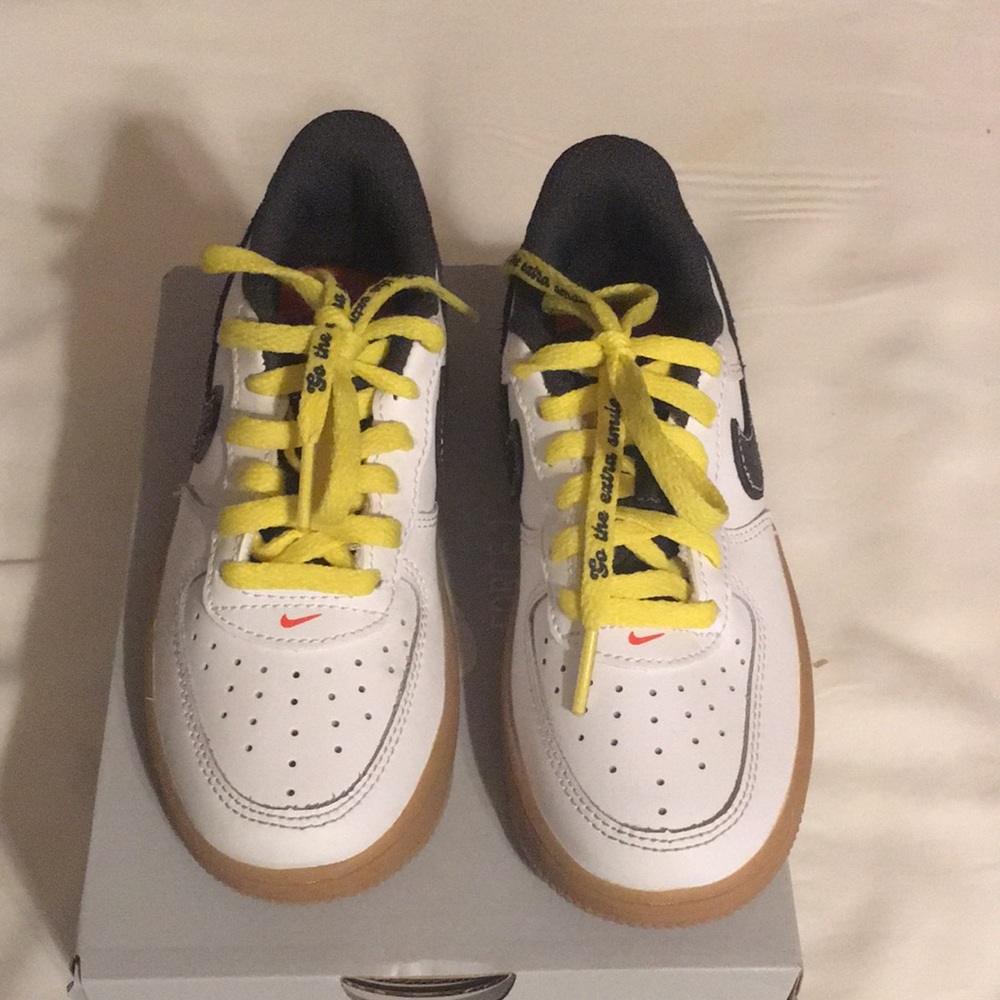 Air Force 1 white leather black swoosh rubber sole worn once in box .